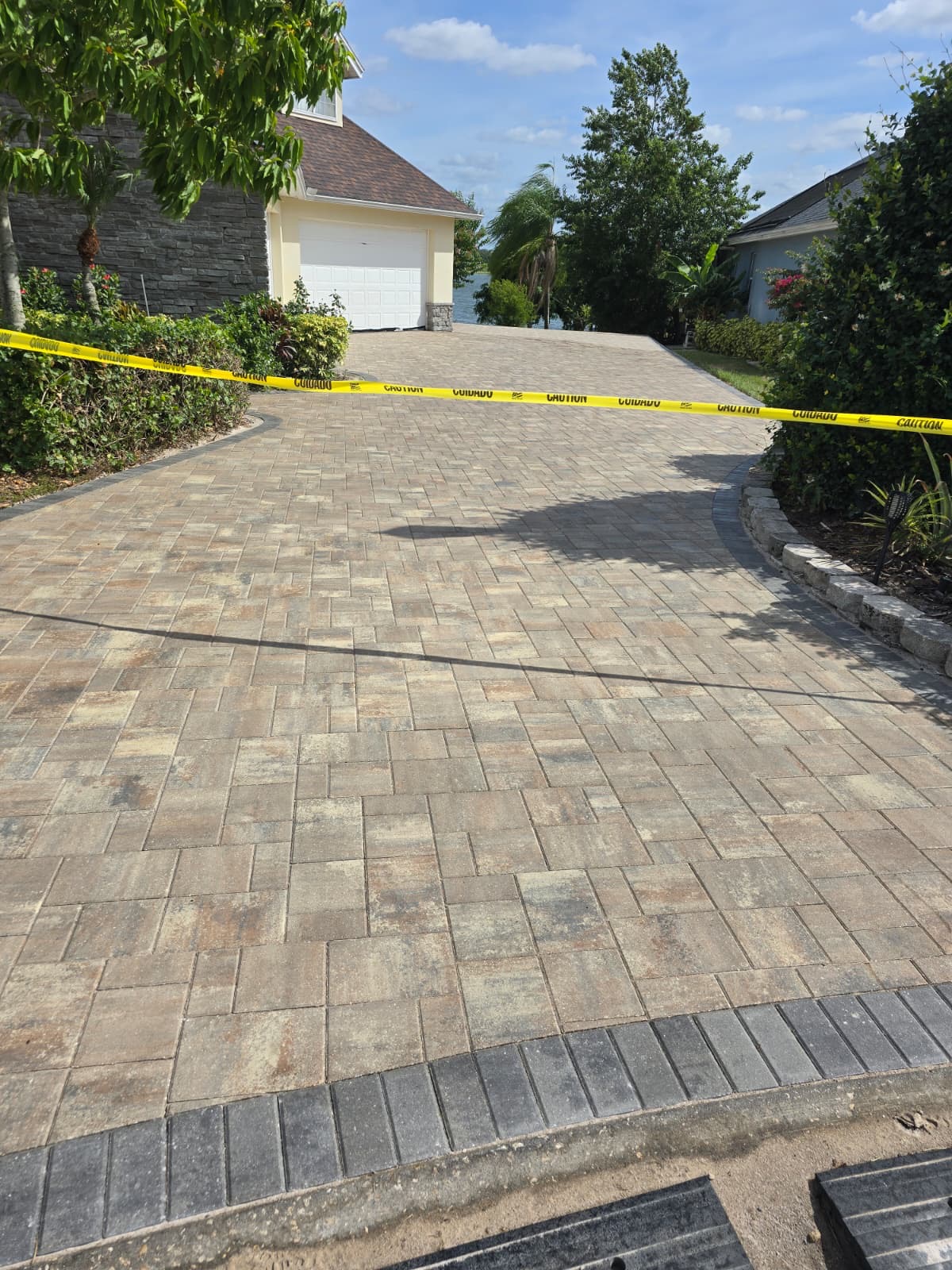 Freshly completed driveway with paver border
